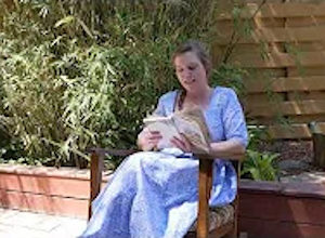 Palmetto Historical Park curator, Tori Chasey, reading "Strawberry Girl" by Lois Lenski